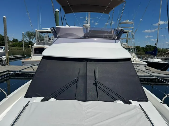 Portkey Yacht Photos Pics 2016 Jeanneau Velasco 37F yacht docked at marina under clear blue sky.