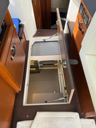 Portkey Yacht Photos Pics Open hatch in Jeanneau Velasco 37F yacht interior, revealing storage compartment.