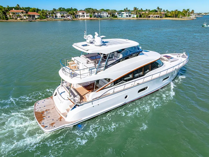 Dog House Yacht Photos Pics 2025 Belize 66 Daybridge yacht cruising on a scenic waterway.