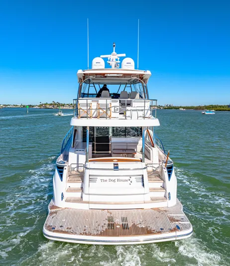 Dog House Yacht Photos Pics 2025 Belize 66 Daybridge yacht cruising on open water under clear blue skies.