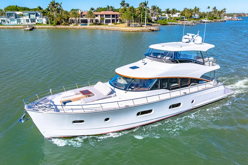 Dog House Yacht Photos Pics 2025 Belize 66 Daybridge yacht cruising in a scenic coastal area.