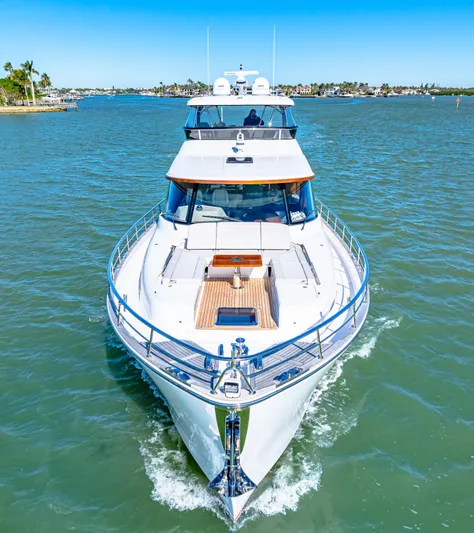 Dog House Yacht Photos Pics 2025 Belize 66 Daybridge yacht cruising on a sunny day in open waters.