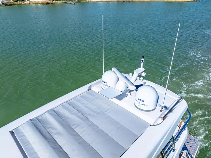 Dog House Yacht Photos Pics 2025 Belize 66 Daybridge yacht with advanced navigation equipment on calm waters.