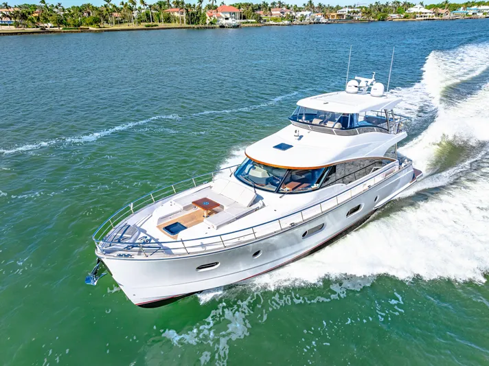 Dog House Yacht Photos Pics 2025 Belize 66 Daybridge luxury yacht cruising on a sunny day.