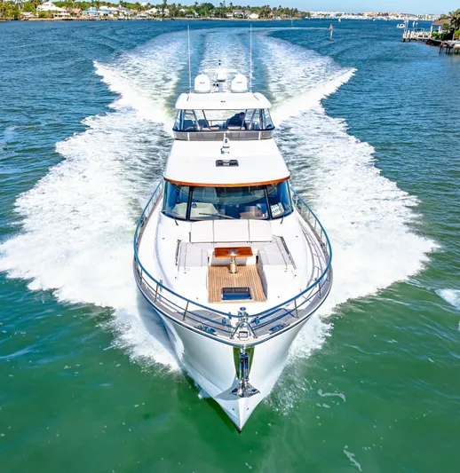 Dog House Yacht Photos Pics 2025 Belize 66 Daybridge yacht cruising on a sunny day, showcasing sleek design and powerful performance.