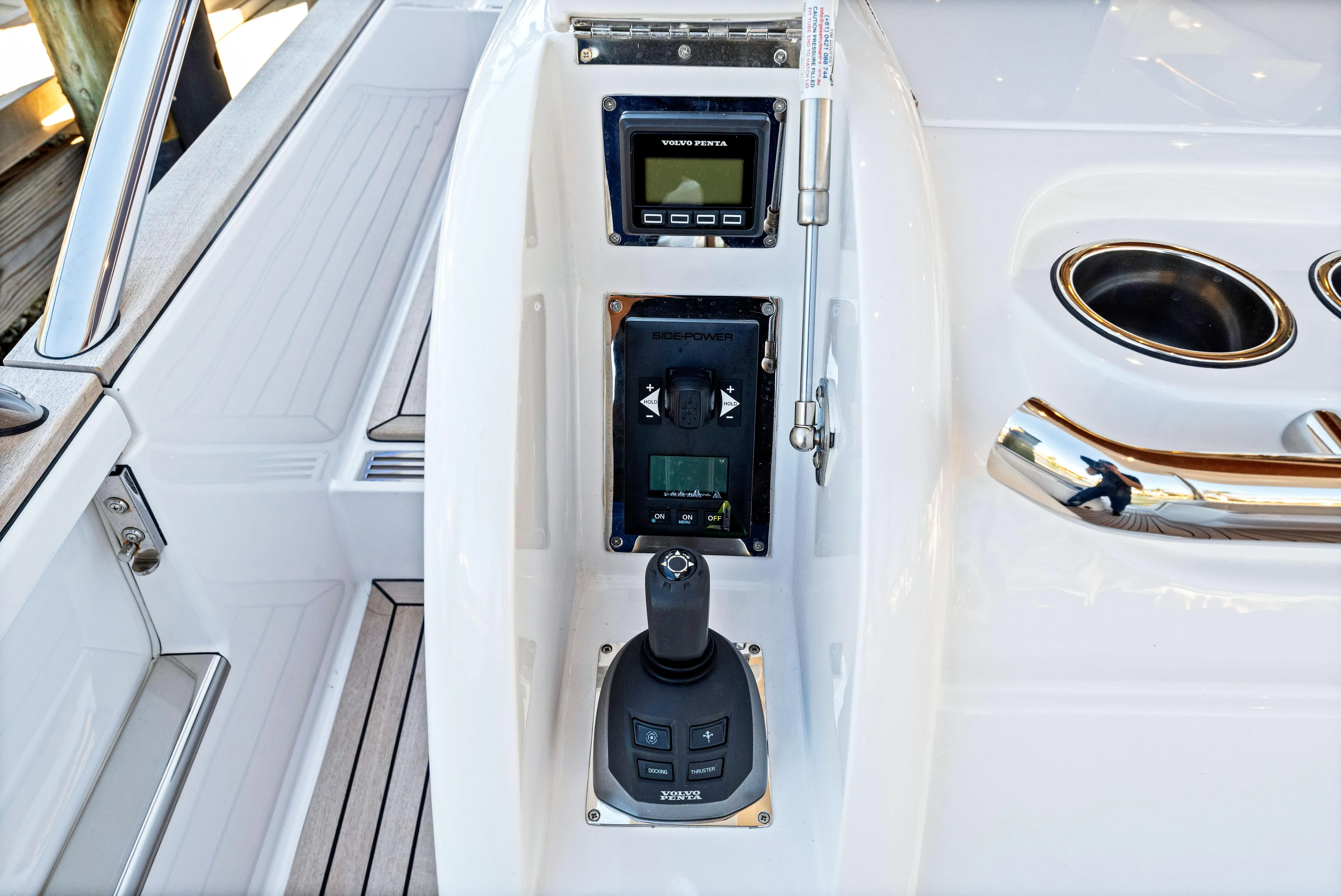 Dog House Yacht Photos Pics Control panel of 2025 Belize 66 Daybridge yacht with joystick and display.