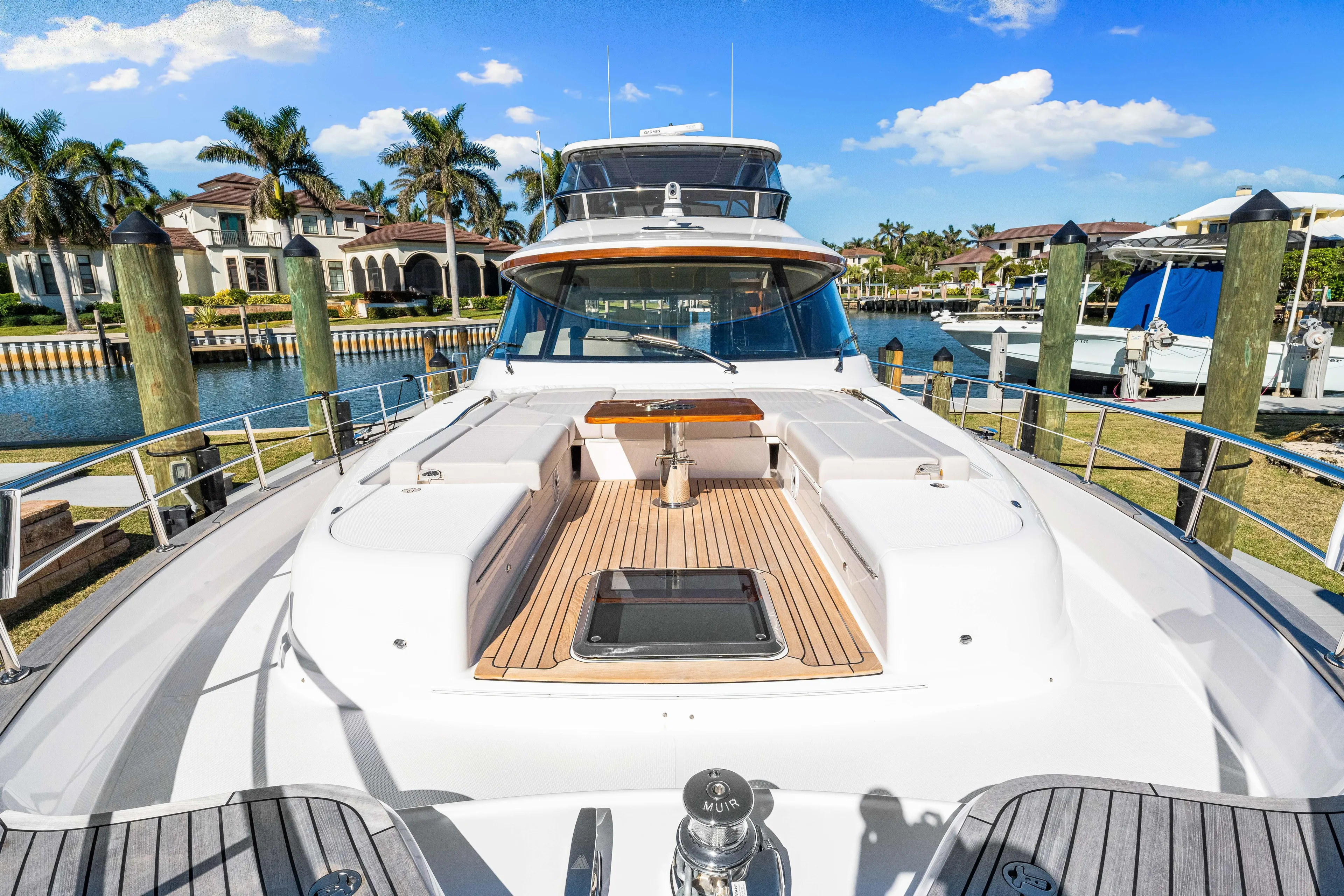 Dog House Yacht Photos Pics 2025 Belize 66 Daybridge yacht docked, showcasing sleek design and luxurious deck features.