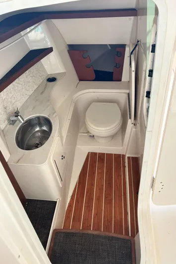  Yacht Photos Pics 2018 Grady-White Freedom 325 boat interior with sink and toilet.