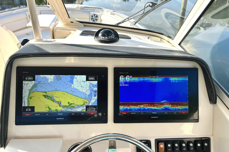  Yacht Photos Pics Dashboard of 2018 Grady-White Freedom 325 boat with navigation and sonar displays.