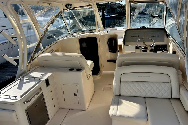  Yacht Photos Pics 2018 Grady-White Freedom 325 boat interior with luxurious seating and helm.