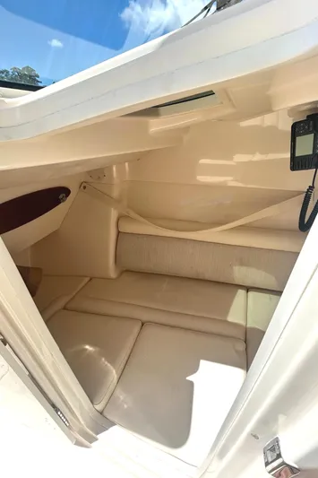 Yacht Photos Pics 2018 Grady-White Freedom 325 cabin interior with beige seating and natural light.