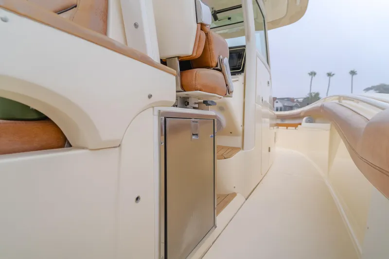 Last Look Yacht Photos Pics 2016 Scout 350 LXF boat interior with seating and storage compartment.