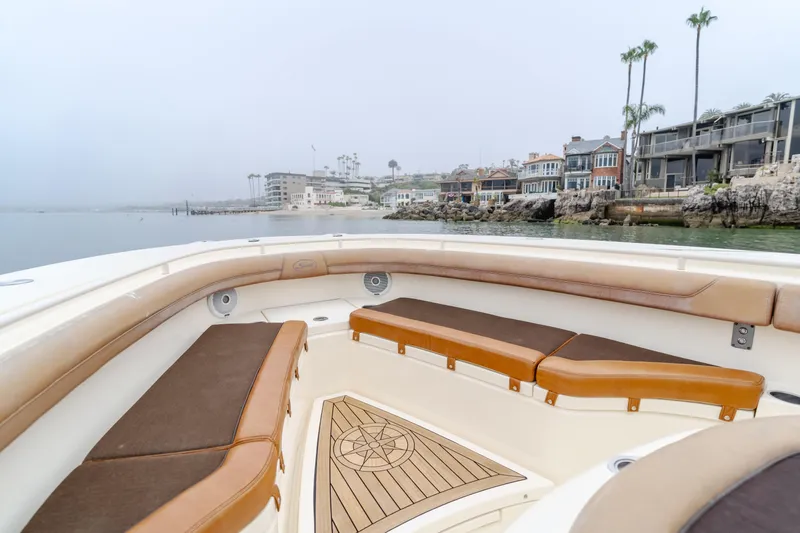 Last Look Yacht Photos Pics 2016 Scout 350 LXF boat interior with coastal view and luxurious seating.