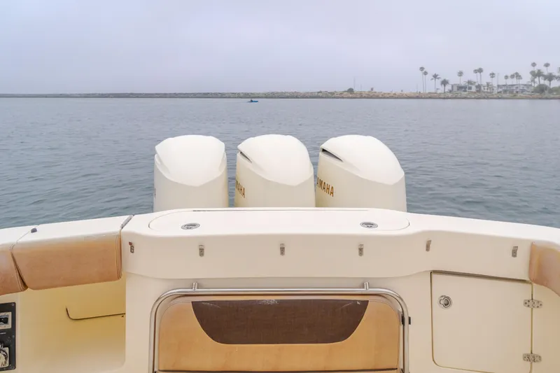 Last Look Yacht Photos Pics 2016 Scout 350 LXF boat with triple engines on calm water.