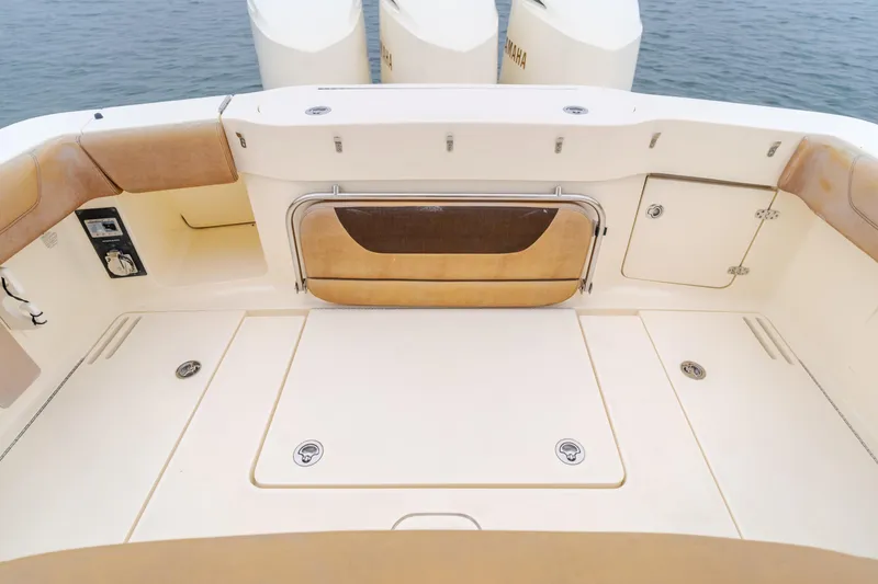 Last Look Yacht Photos Pics 2016 Scout 350 LXF boat deck with storage compartments and seating.