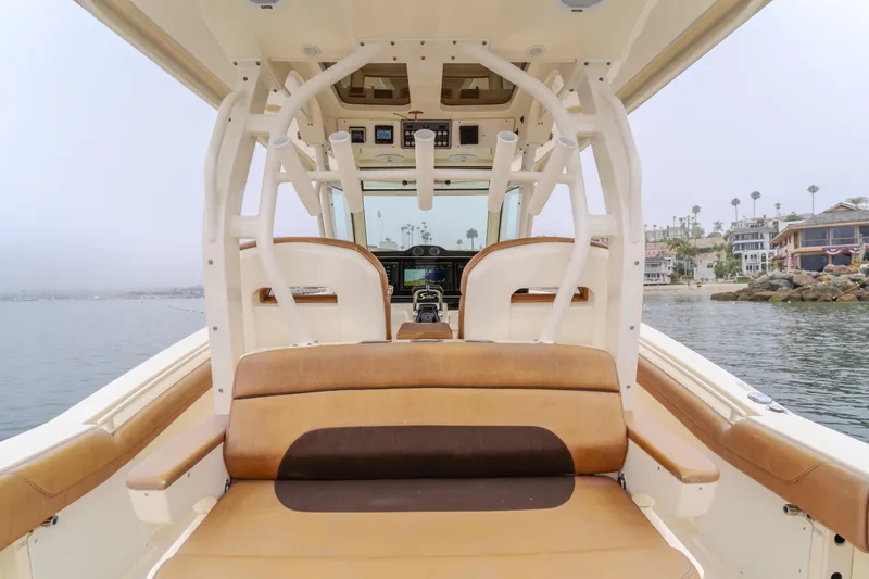 Last Look Yacht Photos Pics 2016 Scout 350 LXF boat interior with tan seating and ocean view.