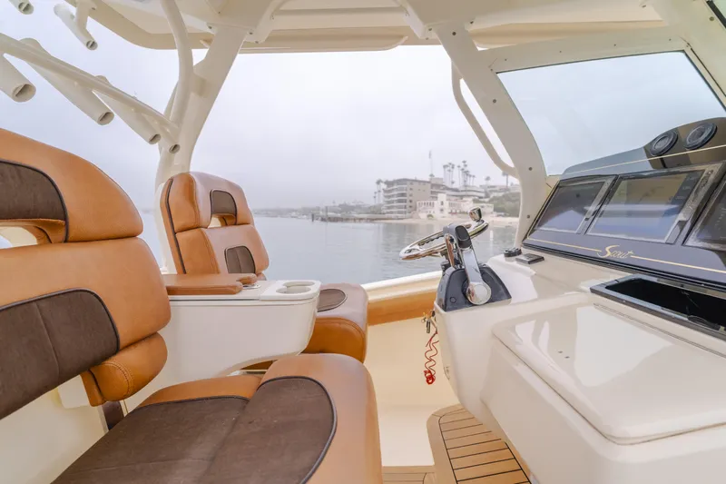 Last Look Yacht Photos Pics Interior of 2016 Scout 350 LXF boat with leather seating and control panel.