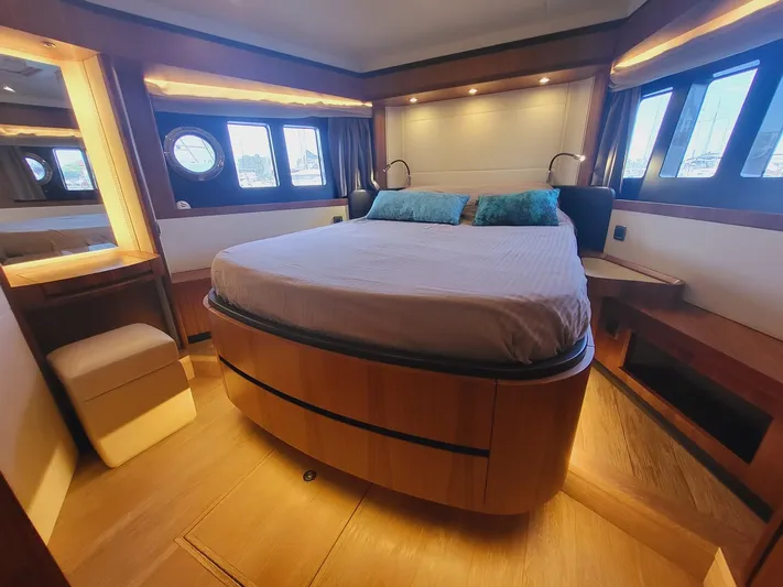  Yacht Photos Pics Luxurious bedroom interior of 2017 Absolute NAVETTA 58 yacht with elegant wood finishes.