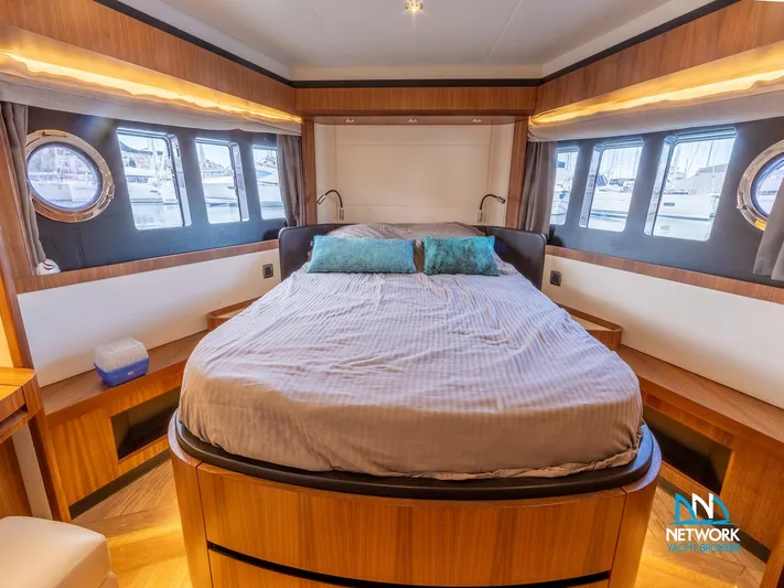  Yacht Photos Pics Luxurious bedroom interior of 2017 Absolute NAVETTA 58 yacht with elegant wood finishes.