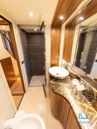  Yacht Photos Pics Luxurious bathroom in 2017 Absolute NAVETTA 58 yacht with elegant wood finishes.