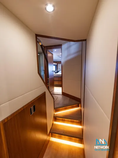  Yacht Photos Pics Interior hallway of 2017 Absolute NAVETTA 58 yacht with illuminated steps and modern design.