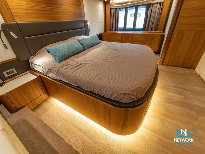  Yacht Photos Pics Luxurious bedroom interior of 2017 Absolute NAVETTA 58 yacht with modern design and ambient lighting.
