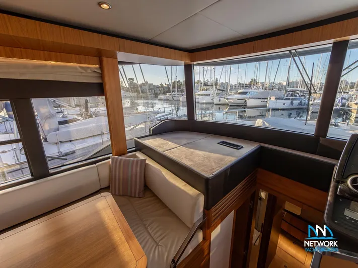  Yacht Photos Pics Luxurious interior of 2017 Absolute NAVETTA 58 yacht with marina view.