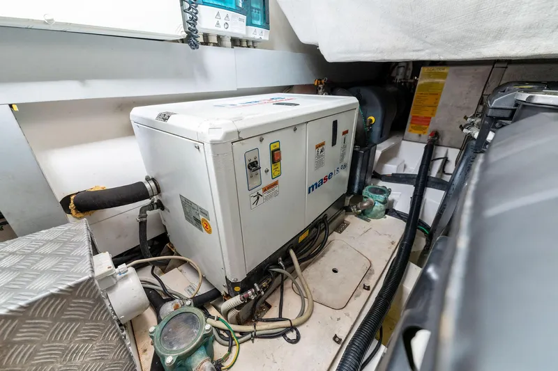 Ice II Yacht Photos Pics Engine room of a 2017 Azimut Atlantis 43 yacht with generator and wiring.