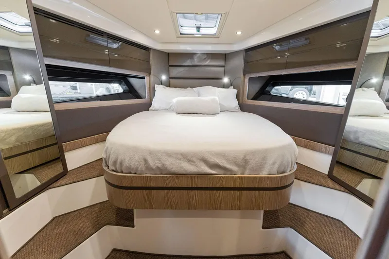Ice II Yacht Photos Pics Luxurious bedroom interior of 2017 Azimut Atlantis 43 yacht with modern design.