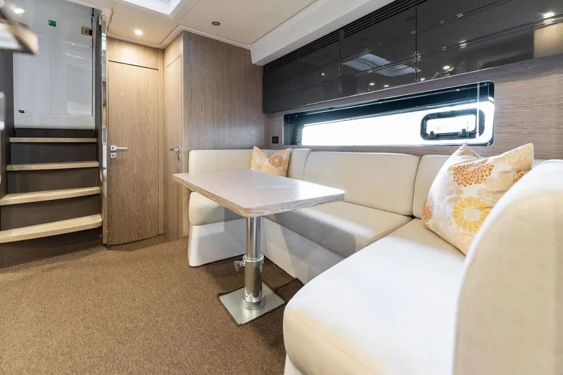 Ice II Yacht Photos Pics Interior of 2017 Azimut Atlantis 43 yacht with modern seating and dining area.