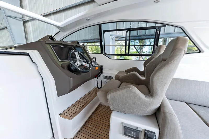 Ice II Yacht Photos Pics Interior helm of 2017 Azimut Atlantis 43 yacht with modern controls and comfortable seating.