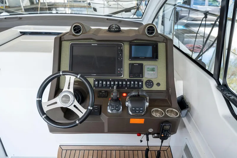 Ice II Yacht Photos Pics 2017 Azimut Atlantis 43 yacht helm with advanced navigation controls and steering wheel.