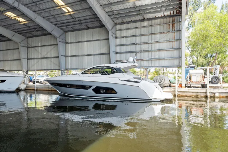 Ice II Yacht Photos Pics 2017 Azimut Atlantis 43 yacht docked in a covered marina.