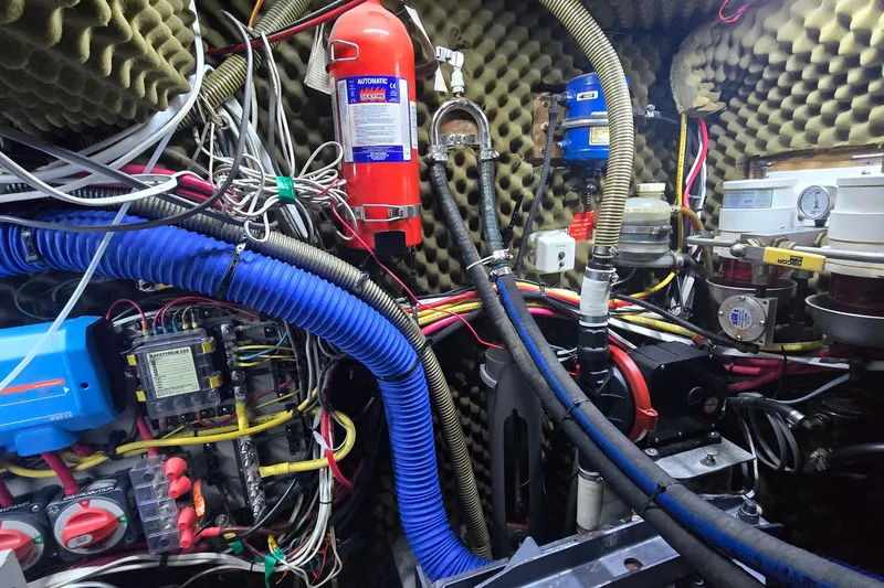 Omorfi Thea Yacht Photos Pics Engine room of a 1993 Amel Santorin yacht with complex wiring and equipment.
