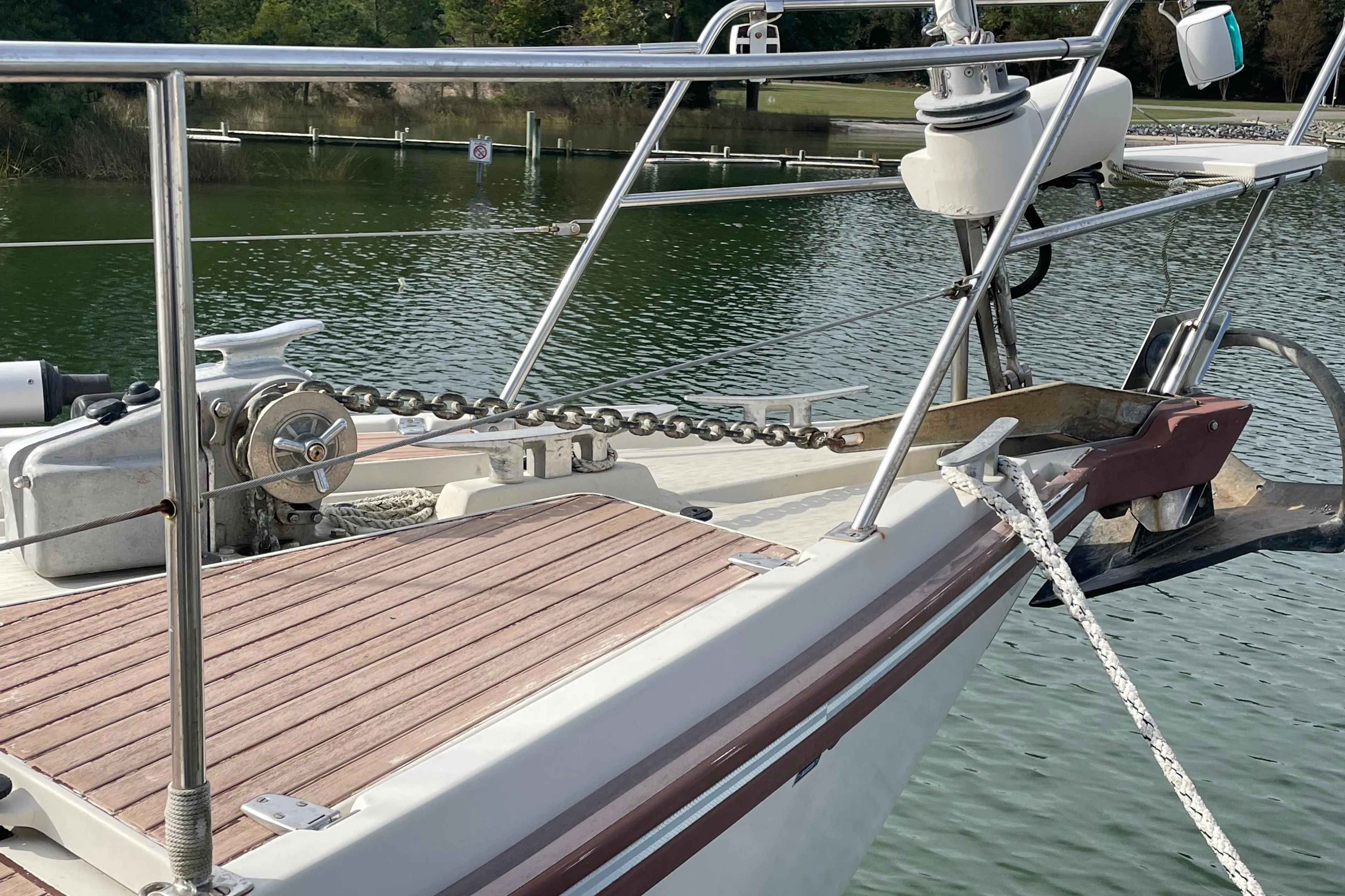 Bow of 1993 Amel Santorin sailboat with anchor and chain on deck.