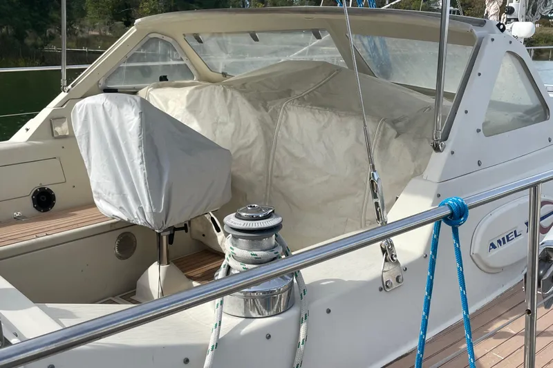 Omorfi Thea Yacht Photos Pics 1993 Amel Santorin sailboat cockpit with covered seating and winch.