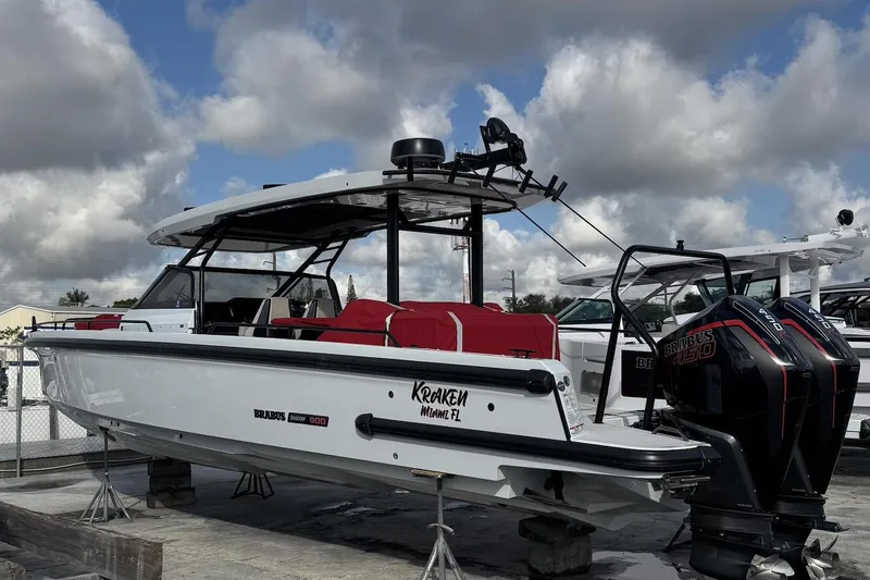 Kraken Yacht Photos Pics 2023 BRABUS Shadow 900 ST boat with twin engines, docked under cloudy skies.