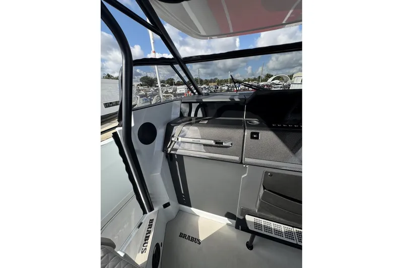 Kraken Yacht Photos Pics Interior view of 2023 BRABUS Shadow 900 ST boat, featuring sleek design and modern controls.