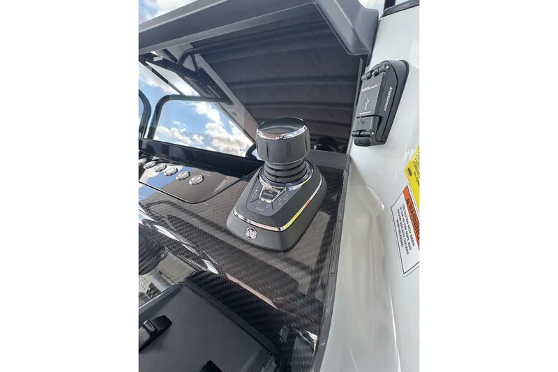 Kraken Yacht Photos Pics Control panel of 2023 BRABUS Shadow 900 ST with joystick and carbon fiber finish.