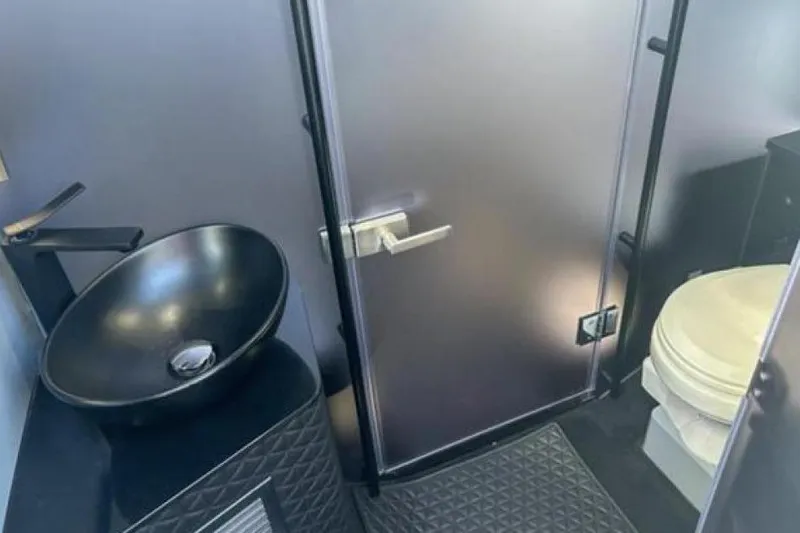 Kraken Yacht Photos Pics Luxurious bathroom interior of 2023 BRABUS Shadow 900 ST with modern sink and toilet.