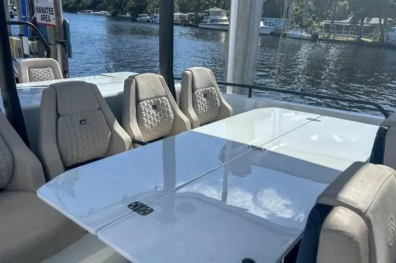 Kraken Yacht Photos Pics Luxurious seating area on 2023 BRABUS Shadow 900 ST yacht, with elegant design and waterfront view.