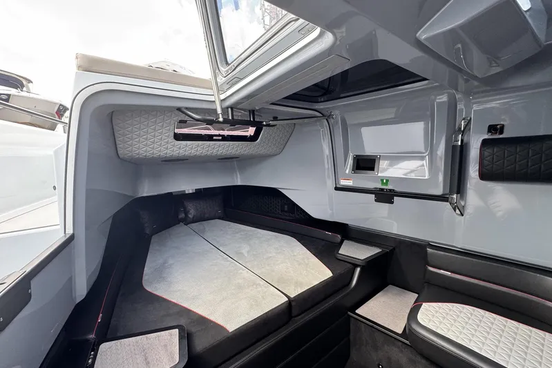 Kraken Yacht Photos Pics Luxurious interior cabin of 2023 BRABUS Shadow 900 ST boat, featuring modern design and comfortable seating.