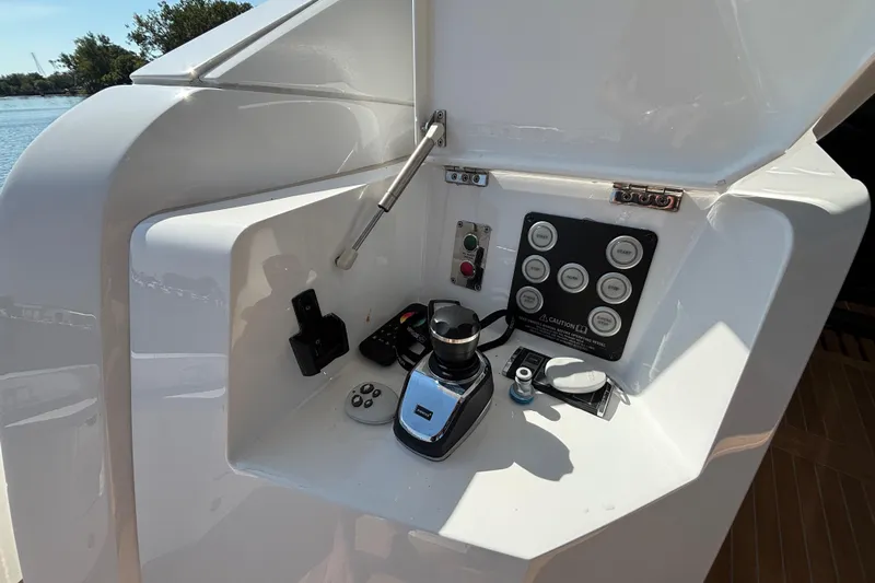  Yacht Photos Pics Control panel of 2018 Sunseeker Predator 74 yacht, featuring joystick and buttons.