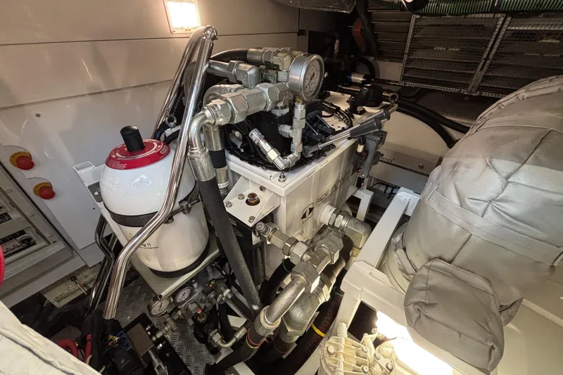  Yacht Photos Pics Engine room of 2018 Sunseeker Predator 74 yacht, showcasing mechanical components and systems.