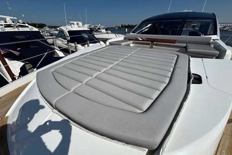  Yacht Photos Pics 2018 Sunseeker Predator 74 yacht with spacious sunbed and sleek design at marina.