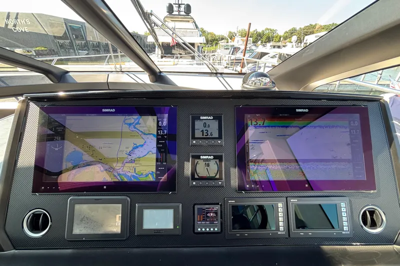  Yacht Photos Pics 2018 Sunseeker Predator 74 yacht dashboard with navigation screens and controls.