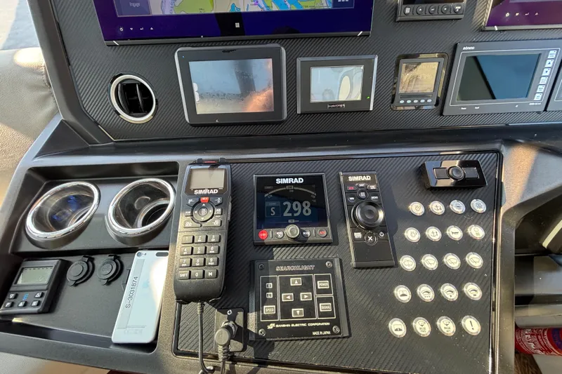  Yacht Photos Pics Control panel of 2018 Sunseeker Predator 74 yacht with navigation and communication systems.