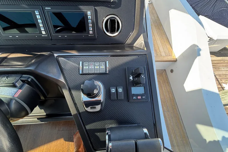  Yacht Photos Pics Control panel of a 2018 Sunseeker Predator 74 yacht, featuring modern navigation displays.