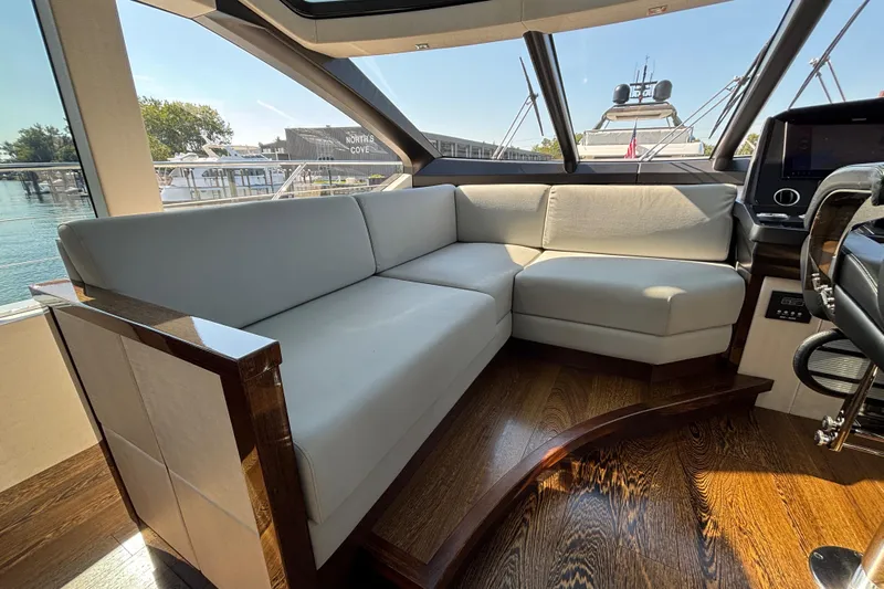  Yacht Photos Pics Luxurious interior of 2018 Sunseeker Predator 74 yacht with elegant seating and wooden flooring.
