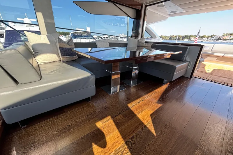  Yacht Photos Pics Luxurious interior of 2018 Sunseeker Predator 74 yacht with elegant seating and wooden flooring.